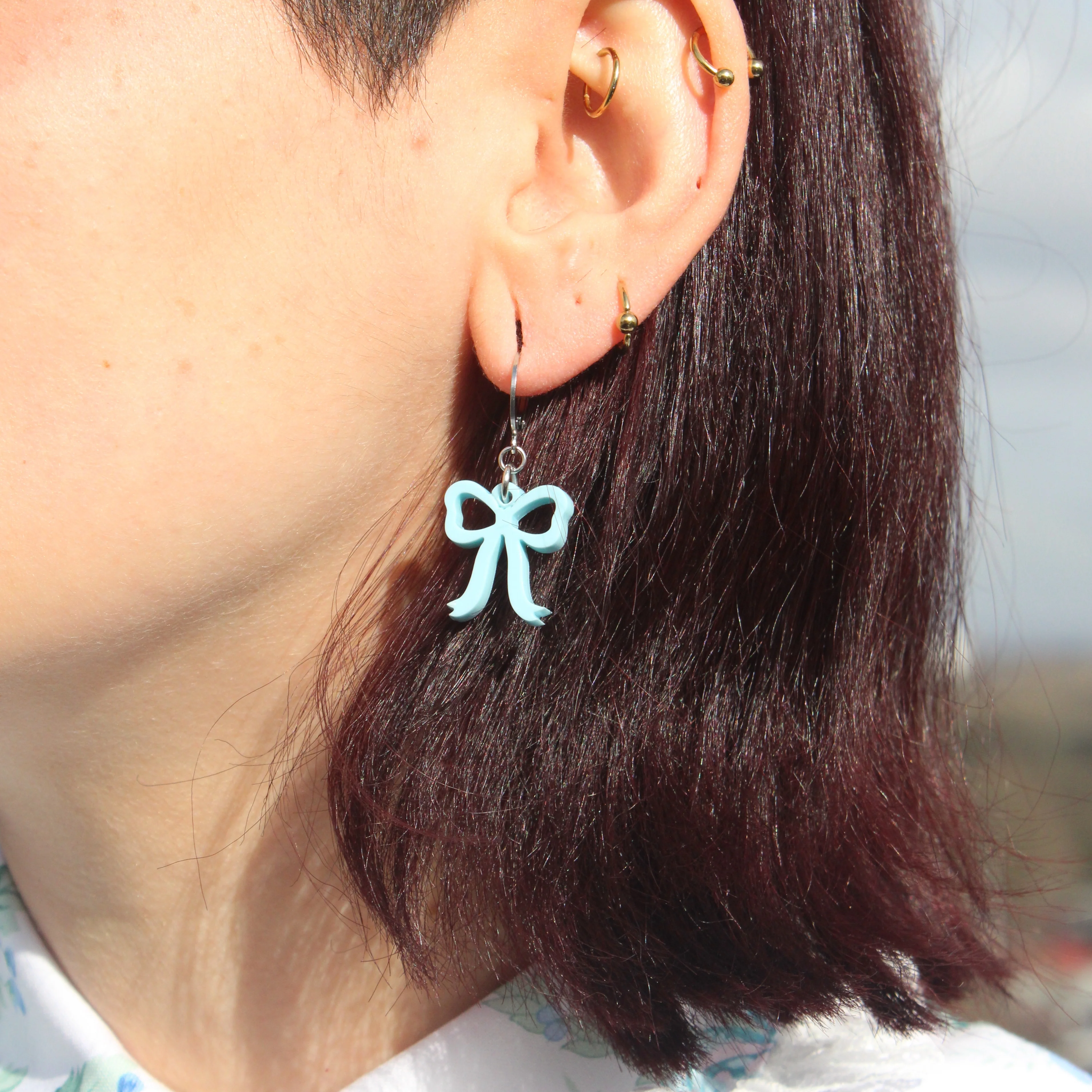 Mini Blue Bow Huggie Hoop Earrings - Image 5