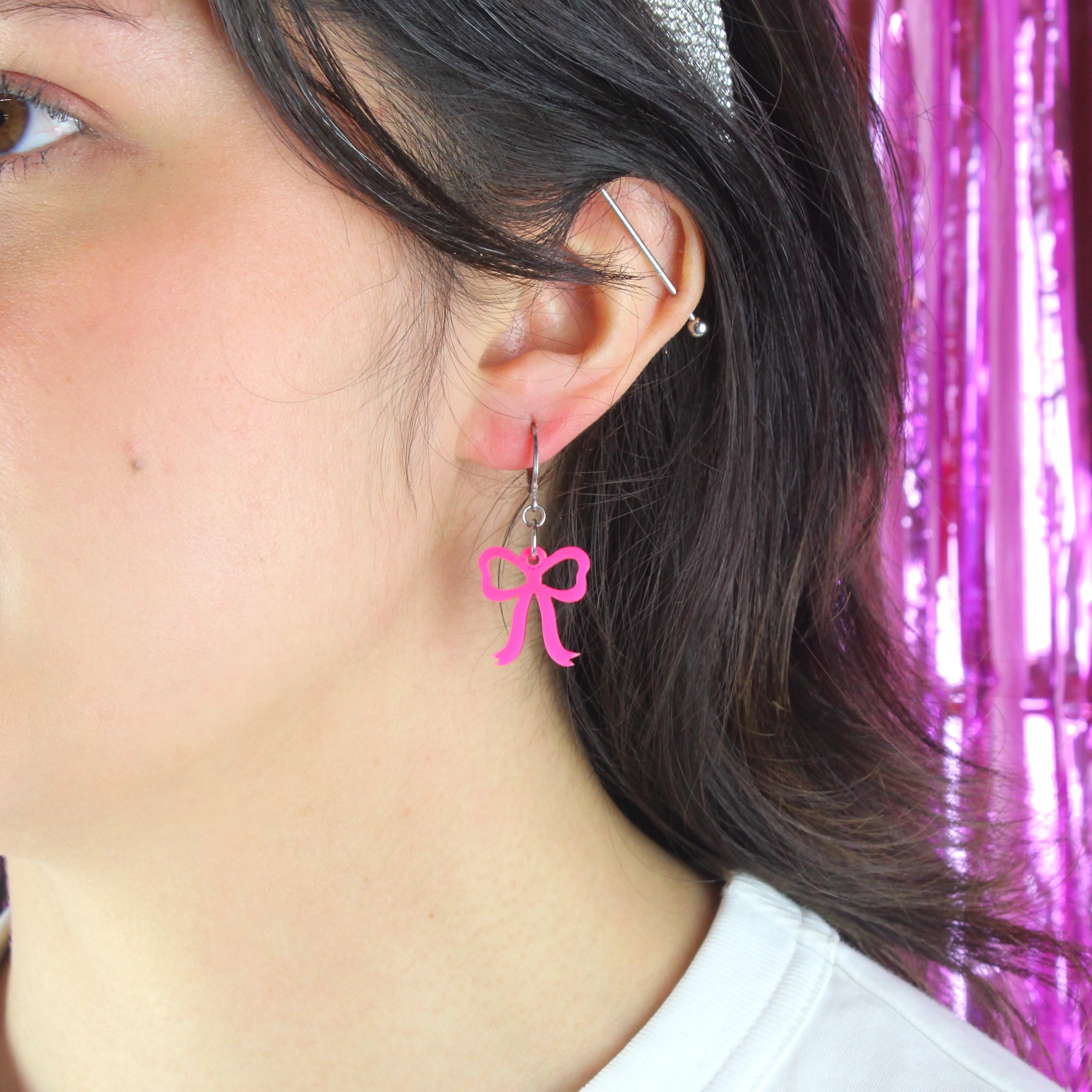 Mini Pink Bow Huggie Hoop Earrings - Image 3